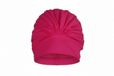 Hot pink pleated swim cap on white background